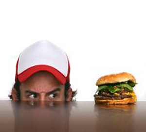 Man looking at hamburger - fasting