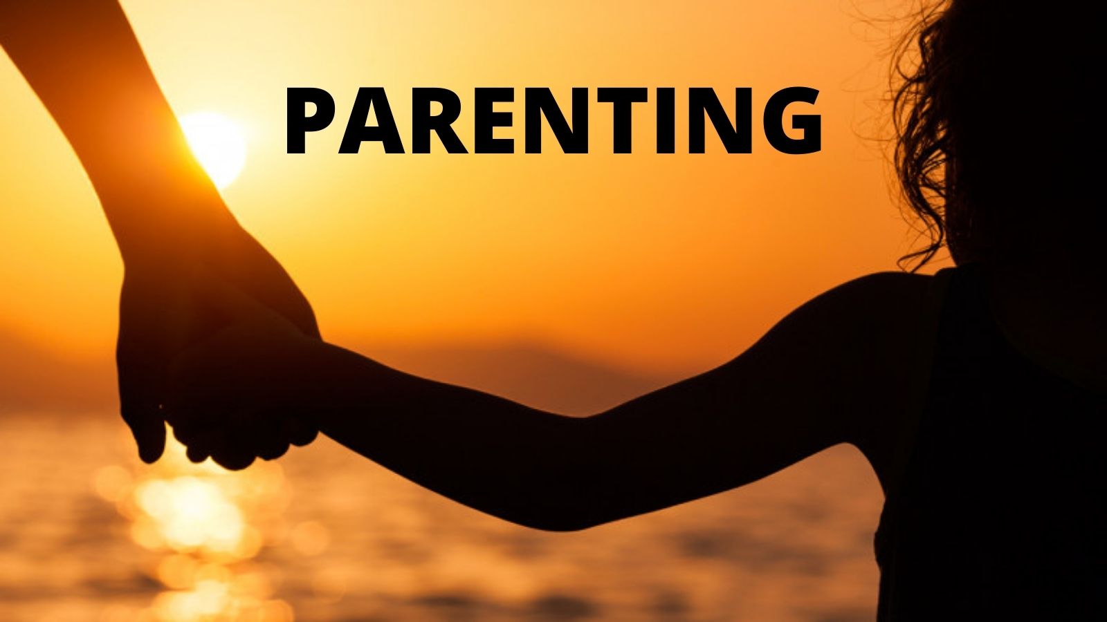Parent and child holding hand in the sunset - Parenting Resource Page